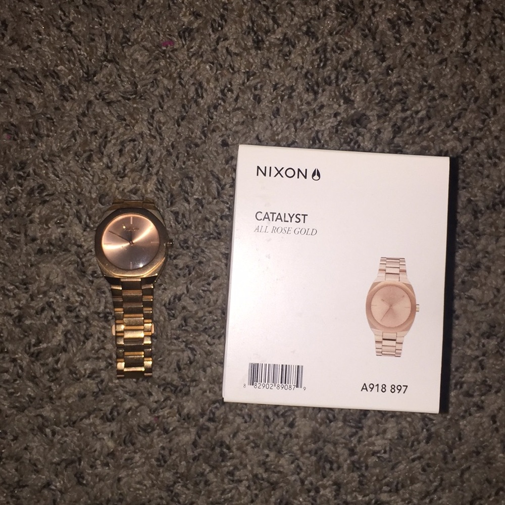 Nixon women’s rose gold watch
